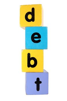 assorted childrens toy letter building blocks against a white background that spell debt with clipping path