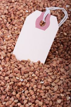 Buckwheat groats with paper label for packing.
