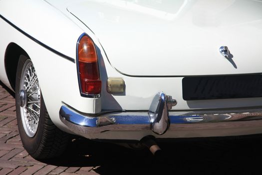 the back of a classic white sportscar