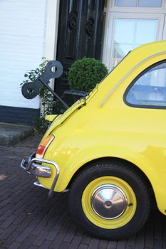 Detail of a small Italian car with a fake wind up mechanism as it were a toy car