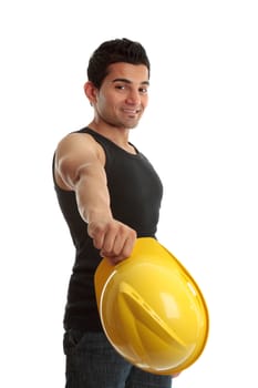 A friendly cosntruction worker, builder or tradesman takes off his hard hat and smiles.  White background.