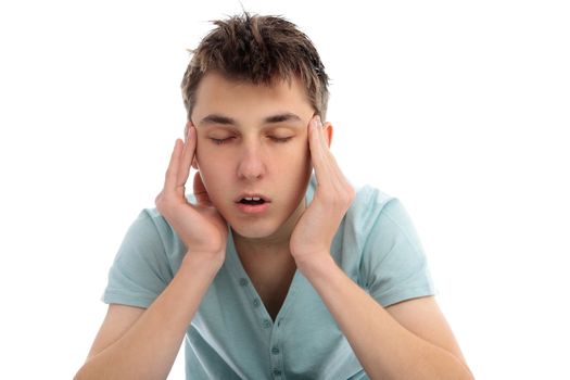 A boy rubbing temples with a headache migrain or maybe stressed.