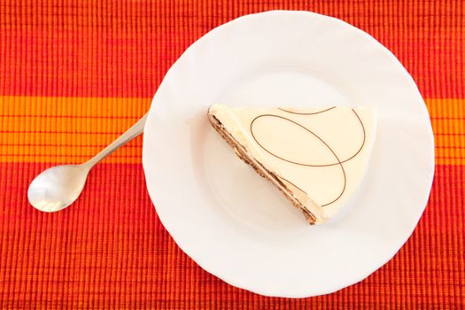 A piece of cake on the white plate