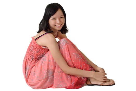 Happy girl sit on ground with smiling face, full length portrait of Asian beauty isolated on white background.