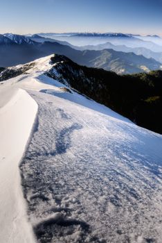 Snow mountain scenic with white slop and blue sky in Taiwan, Asia.