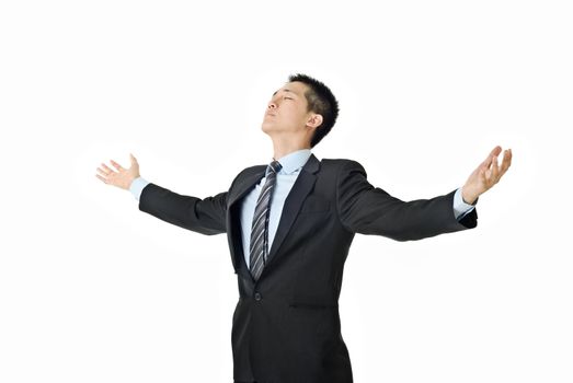Businessman of freedom open arms and close eyes on white background.