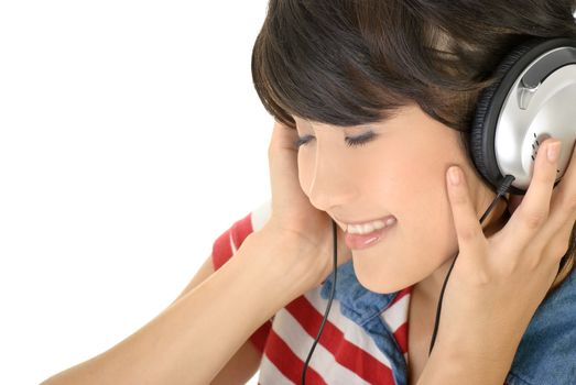 Happy girl listen music by earphone, closeup portrait with copyspace on white background.