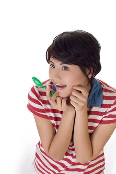 Girl with tablespoon with exciting expression, closeup portrait on white background.
