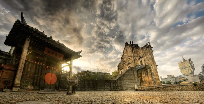Macao scenery of panorama with Chinese traditional temple, ruins of Saint Paul's Cathedral and modern skyscraper in Macau, China.