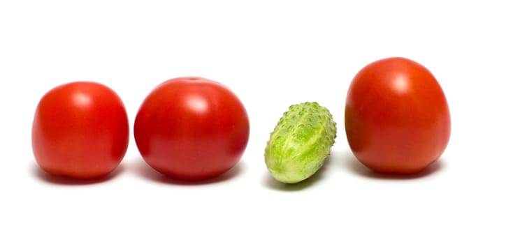 Three red tomato and cucumber isolated on a white background.