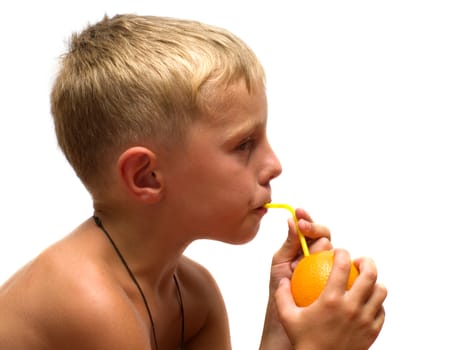 Boy drinking orange juice through straws isolated on a white background.