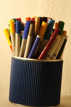 coloured felt-tips in a container