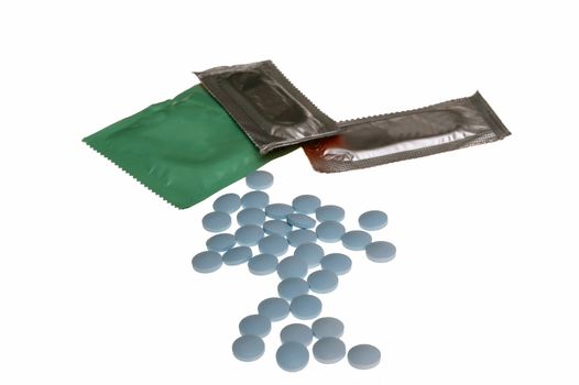 Birth Control Pills and a Condom isolated on white