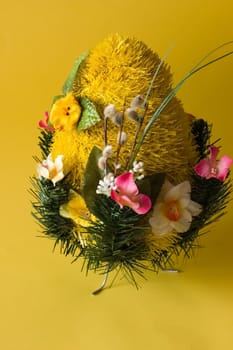 Festive egg with chicken on yellow background