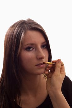 Putting the make-up on the face