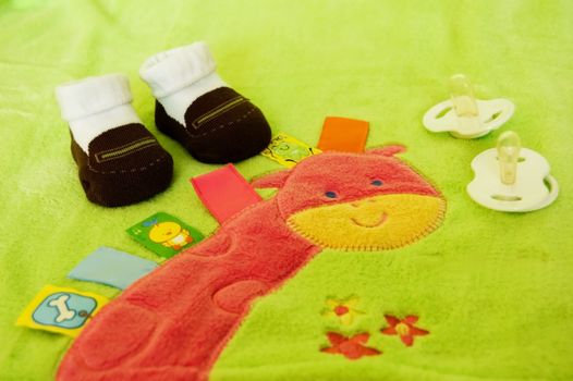 Essential children's accessories on green background , for each baby 