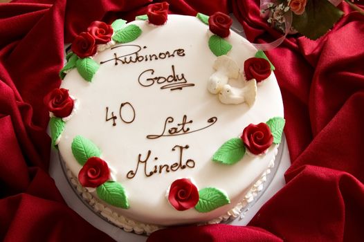 White Wedding Cake with Red Roses,