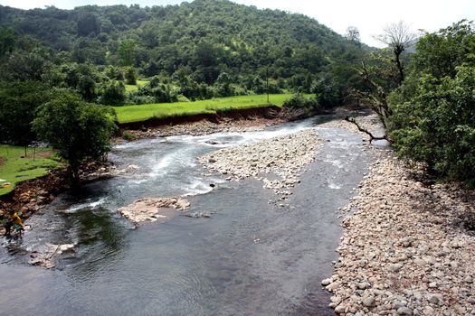 A wild river flowing in the Indian Himalayas.