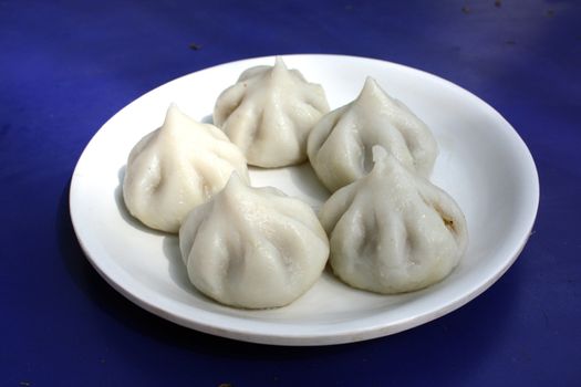 A served plate of the holy recipe called "Modak", considered to be the favorite food of Hindu Lord Ganesha. A highly saleable image with Ganesh festival next fornight.