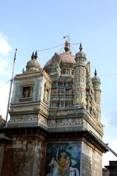 A background with a view of the beautiful crafted domes of an ancient temple at Jejuri, India.