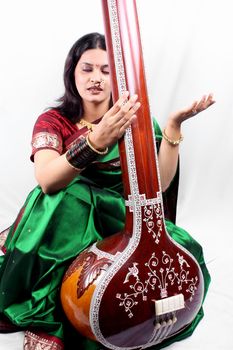 An Indian classical singer with the string instrument called Tanpura.