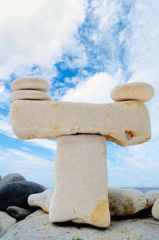 Model of Scales is made of stones on the seashore