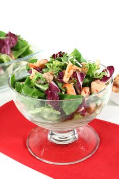 Mixed salad with crayfish on a white background