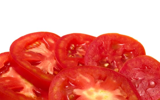 Cut tomato closeup on a white background.