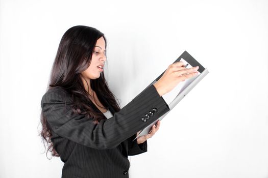 An Indian businesswoman checking documents, on a white background.