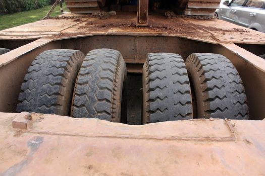The tires structured inside a huge truck trailer.