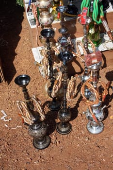 Antique Hookahs for sale in an Indian flea market.