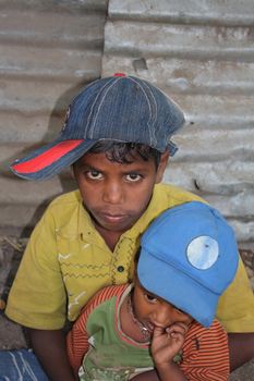 A portrait of poor beggar brothers from India.