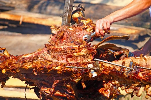 Roasting ox on a fire at a festival