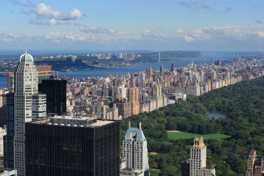 Photo of Central Park and Upper West Side with the George Washington Bridge in the background.