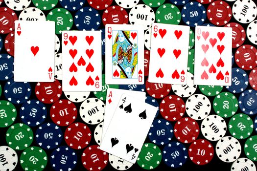 A winning hand of poker with a pair of aces, on colorful gambling chips.