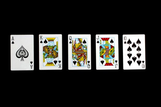 A 'Royal Flush' hand of spades from the game of poker, isolated on black background.