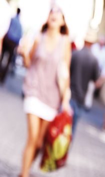 blurred unrecognizable people in motion in a shopping mall