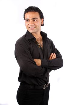 A handsome Indian model posing in a black dress, isolated on white studio background.