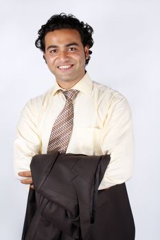 A portrait of a young Indian businesman, in a happy mood.