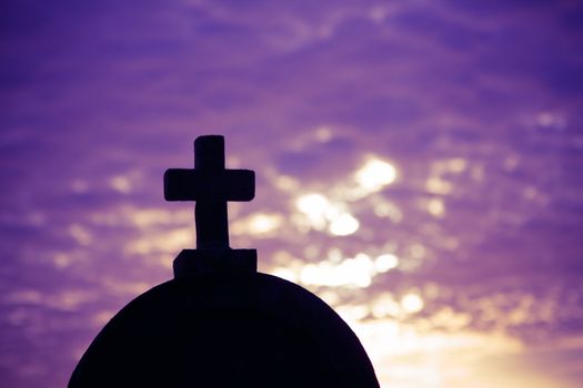 Silhouette of a church in the sunset time on a sunny cloudy summer evening