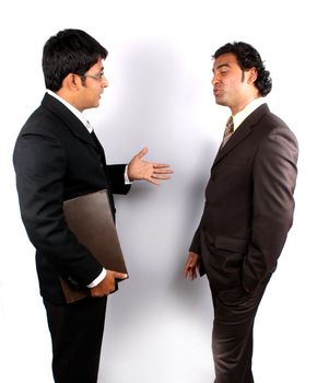 Two young Indian businessman in an argument.