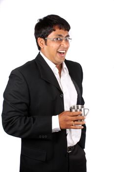 A young Indian businessman in a jolly mood, on white studio background.