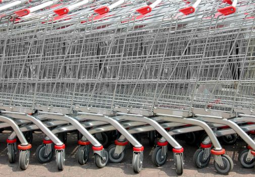 Row of supermarket shopping cart trolleys