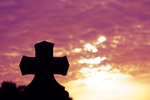 Silhouette of a church in the sunset time on a sunny cloudy summer evening