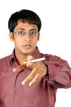 A young Indian executive with a cigarette in his hand in an angry mood, on white studio background.