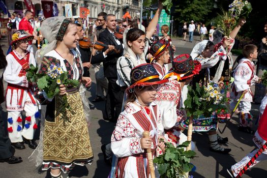 RIGA, LATVIA - JULY 10: A parade by festival participants of Latvian Youth Song and Dance Celebration through the centre of Riga, 10 July, 2010