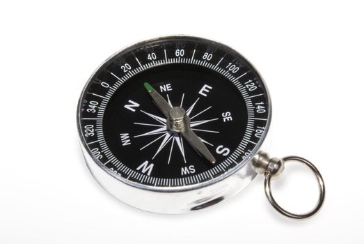 Closeup black compass on a white background