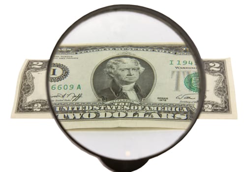 two dollars and magnifying glass insulated on white background