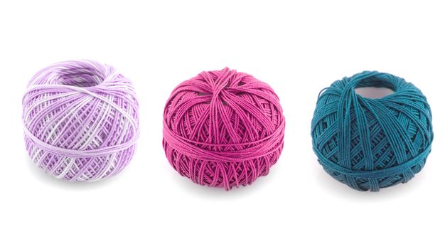 spools of many colors on a white background.