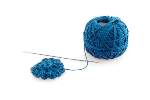 Blue spool and needle on a white background.